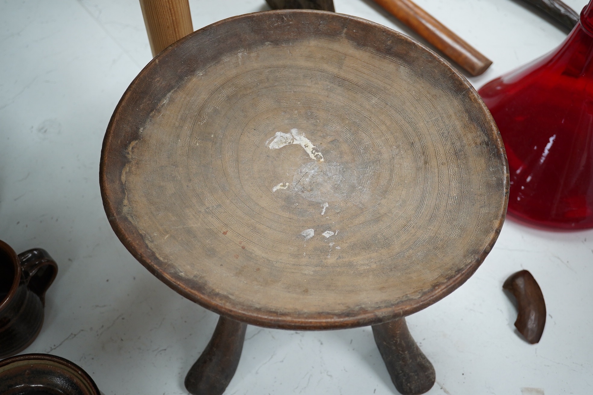 An African five-legged wooden bowl, 21cm high. Condition - fair